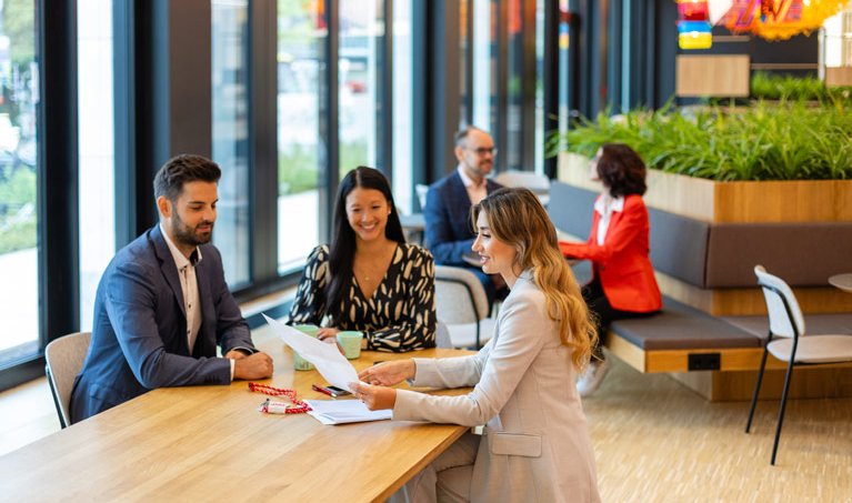 Deka employees in a business meeting