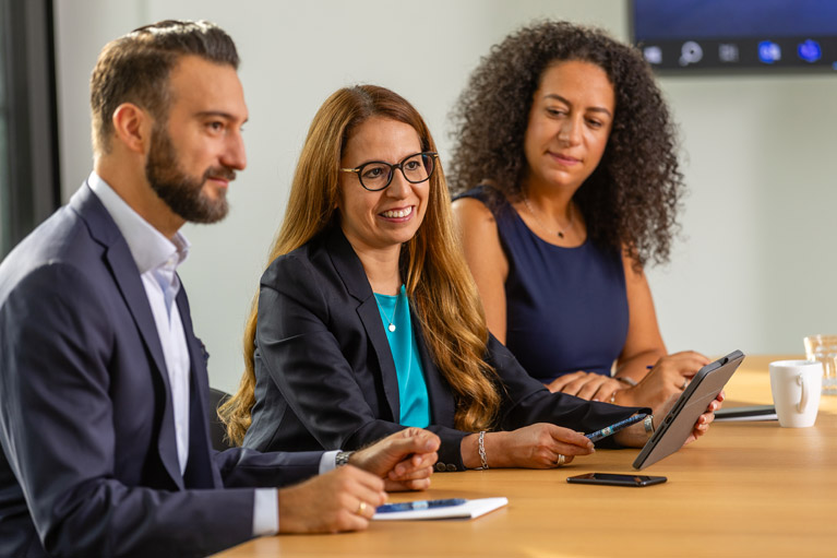 Deka colleagues in a meeting